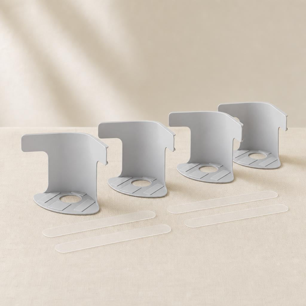 Pack de cuatro sujetadores de sabana con tiras adhesivas transparentes